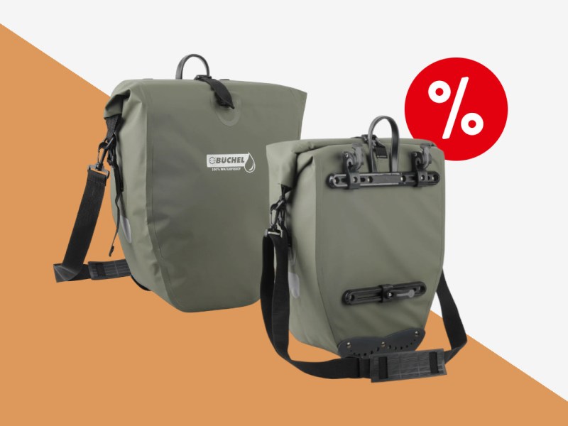 Fahrradtasche von Büchel in Olive schwarz von vorne und hinten mit Schultergurt auf orangenem Hintergrund mit rotem Prozentbutton oben rechts