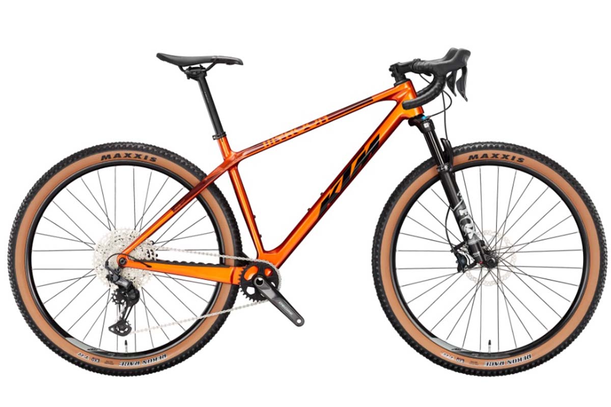 organgenes Gravelbike auf weißem Grund